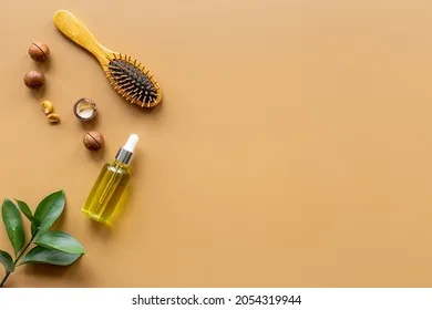 macadamia-oil-hair-care-wooden-260nw-2054319944 Dầu Macadamia Tinh hoa từ thiên nhiên giúp phục hồi mái tóc hư tổn